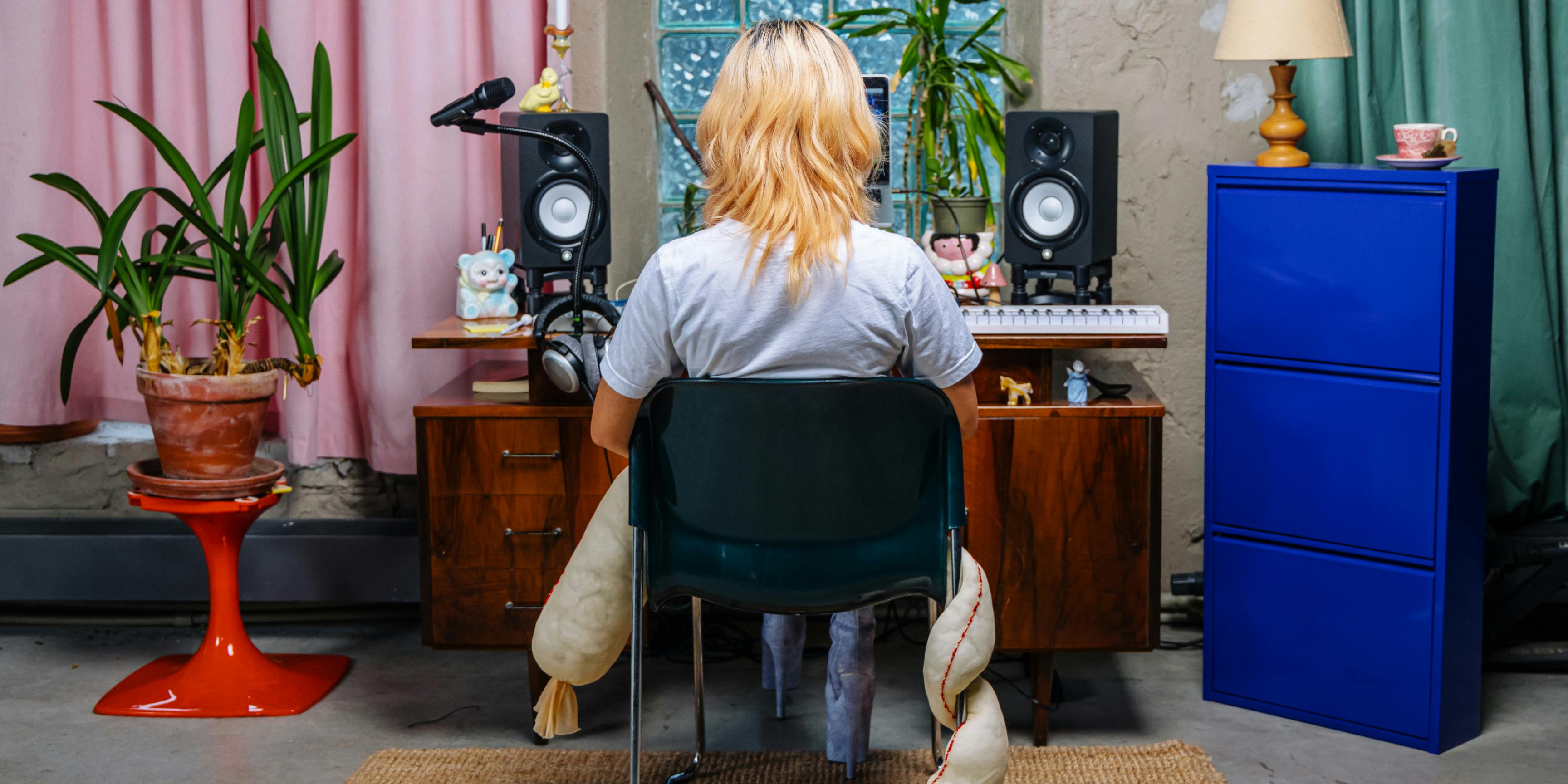 Blond woman studio monitors